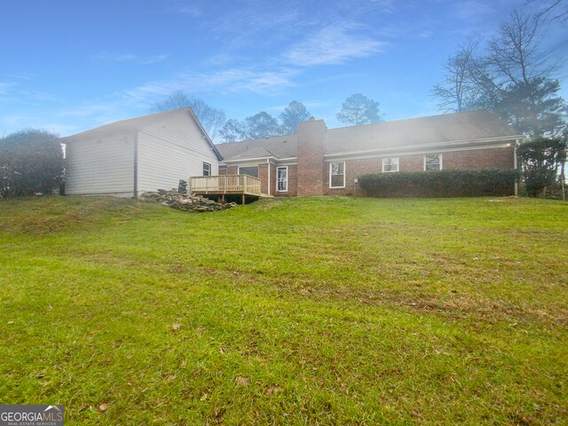 view of yard with a deck