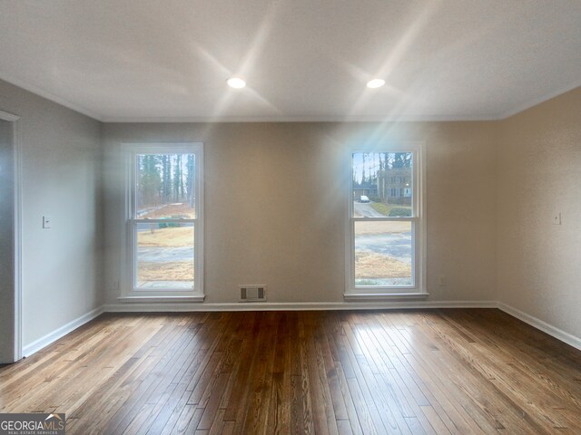 empty room with light hardwood / wood-style flooring