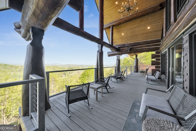 wooden terrace featuring an outdoor hangout area