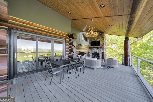 deck featuring a stone fireplace