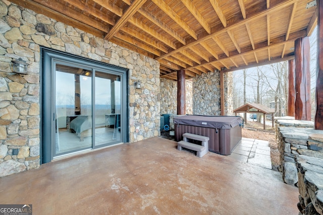 view of patio / terrace featuring a hot tub