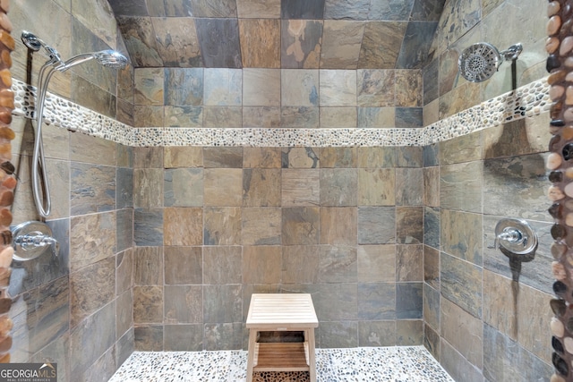 bathroom featuring tiled shower