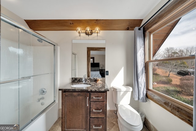 full bathroom featuring bath / shower combo with glass door, toilet, tile floors, and vanity