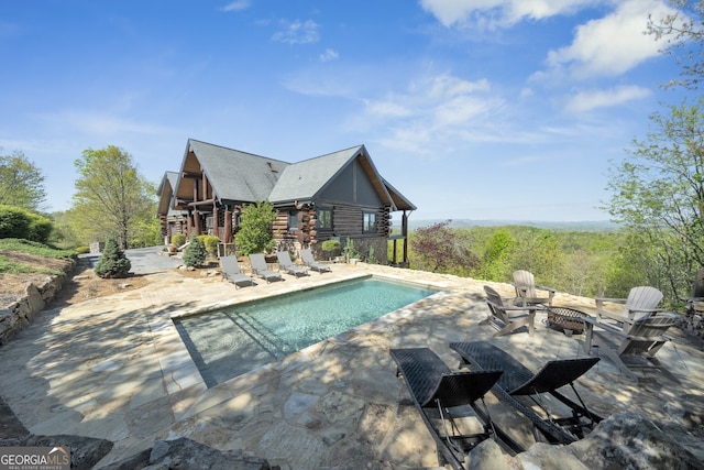 view of pool featuring a patio area