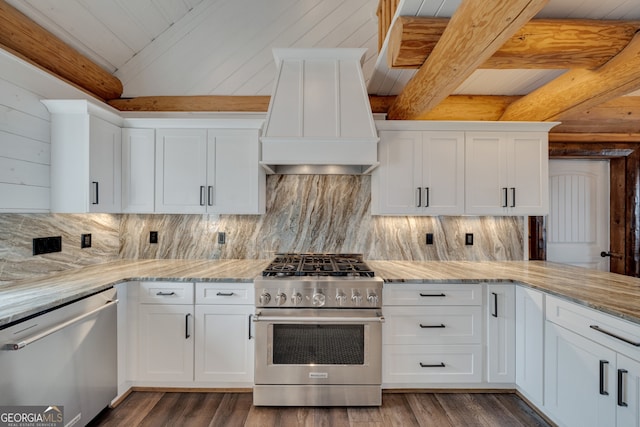 kitchen with appliances with stainless steel finishes, beam ceiling, white cabinetry, and custom range hood