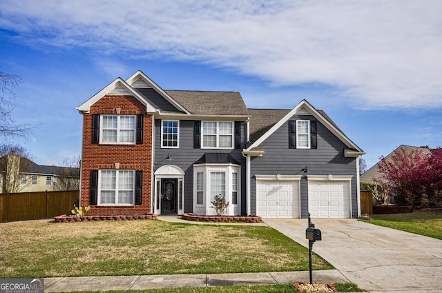 view of front of property with a front yard and a garage