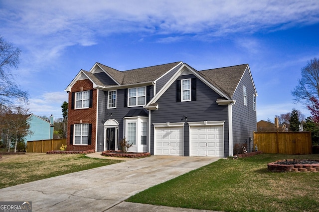 view of front of house with a front yard and a garage