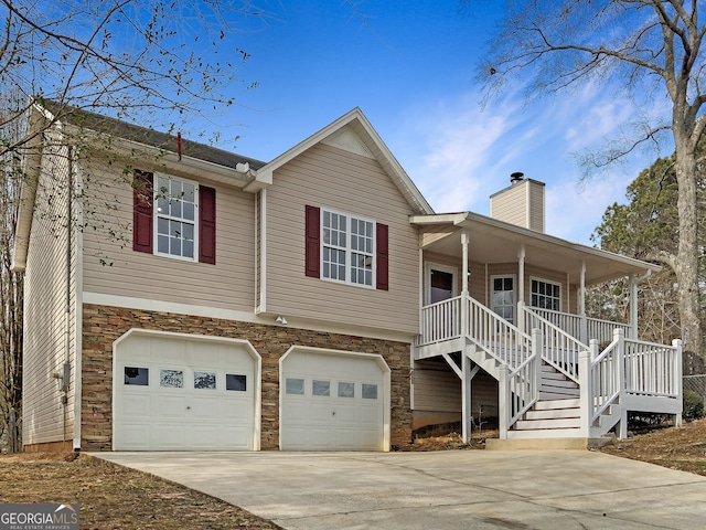 view of front of house featuring covered porch and a garage