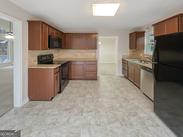 kitchen with ceiling fan, backsplash, light tile floors, and black appliances