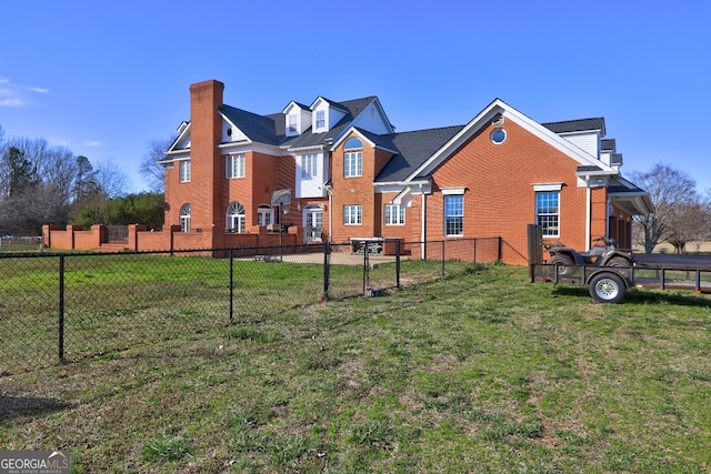 back of house featuring a yard