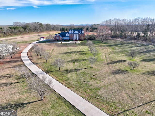 birds eye view of property featuring a rural view