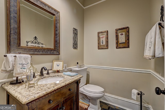 bathroom with tile floors, toilet, and vanity