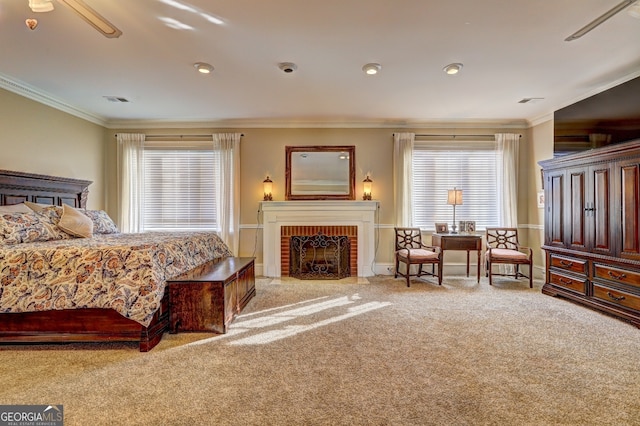 bedroom with multiple windows, a fireplace, ornamental molding, and light carpet