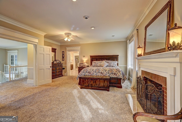 carpeted bedroom with ceiling fan and ornamental molding