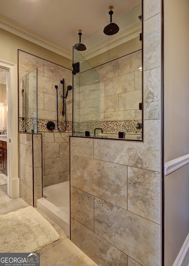 bathroom featuring tile flooring, ornamental molding, an enclosed shower, and vanity