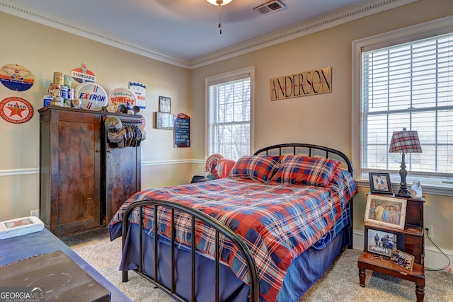 bedroom with light carpet, ceiling fan, and ornamental molding