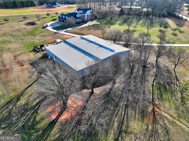 birds eye view of property featuring a rural view