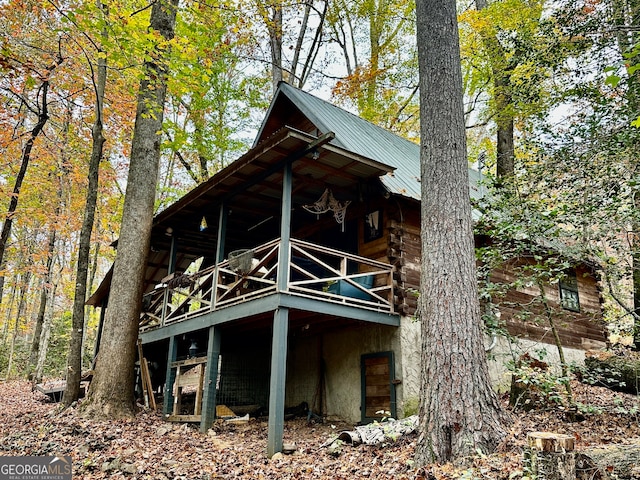 view of side of property featuring a wooden deck