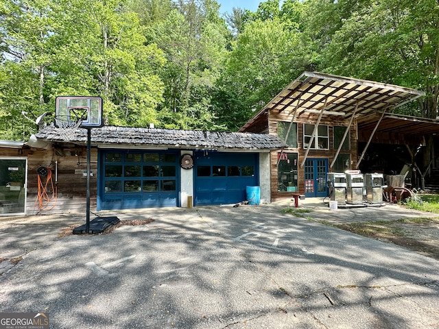 view of front of house featuring french doors and a carport