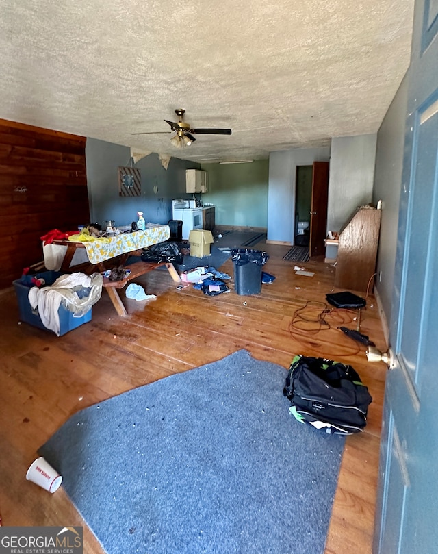 interior space with hardwood / wood-style floors, a textured ceiling, and ceiling fan