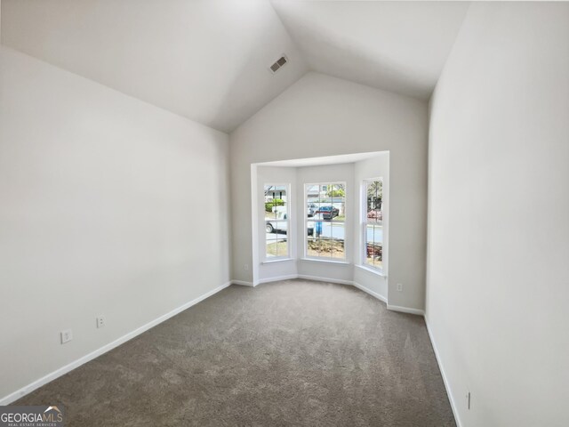 338 Hunterian Pl, Newnan, GA 30265 - unfurnished room with carpet floors, visible vents, lofted ceiling, and baseboards