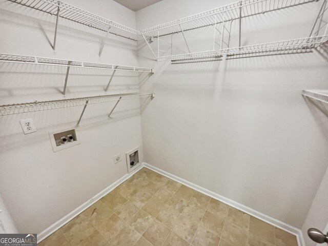 338 Hunterian Pl, Newnan, GA 30265 - laundry room featuring electric dryer hookup, hookup for a washing machine, laundry area, and baseboards