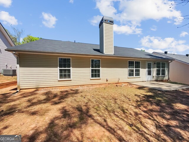 338 Hunterian Pl, Newnan, GA 30265 - rear view of property featuring a chimney, central air condition unit, and a patio