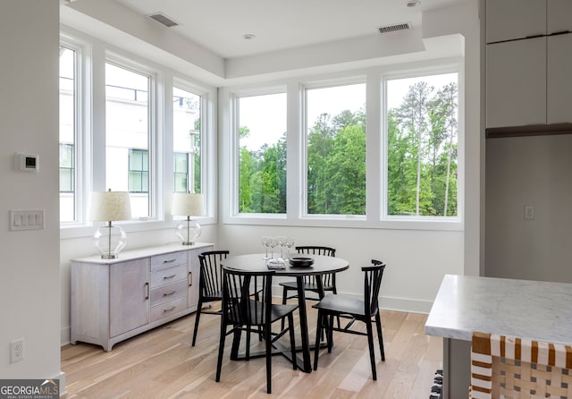 sunroom / solarium featuring a healthy amount of sunlight