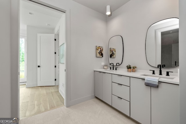 bathroom with wood-type flooring and vanity