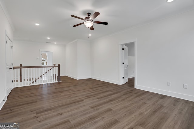 unfurnished room with ceiling fan, dark hardwood / wood-style floors, and ornamental molding