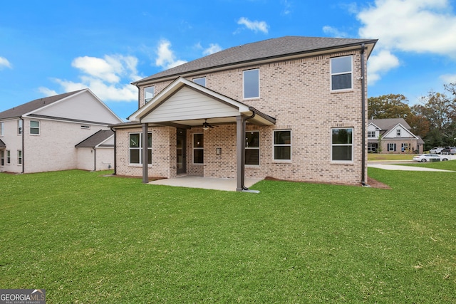 rear view of house featuring a patio, a lawn, and ceiling fan