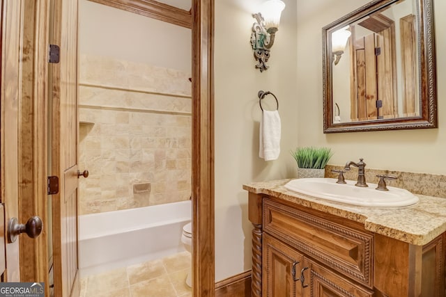 full bathroom featuring toilet, vanity, tiled shower / bath, and tile flooring