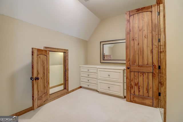 carpeted bedroom featuring vaulted ceiling