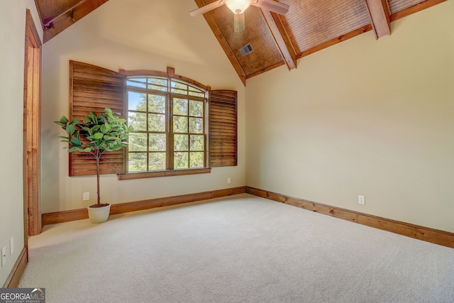 spare room featuring ceiling fan, light colored carpet, beamed ceiling, and high vaulted ceiling