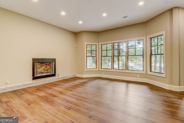 unfurnished living room with light hardwood / wood-style flooring