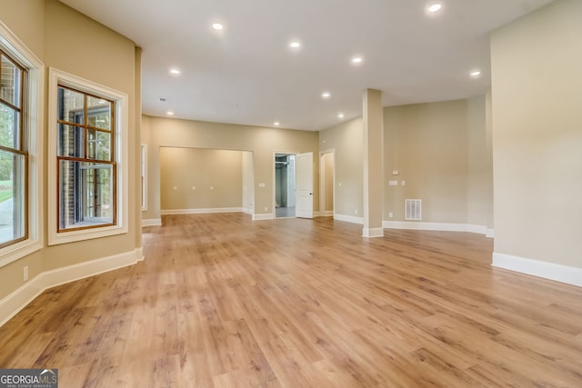 spare room featuring light hardwood / wood-style floors