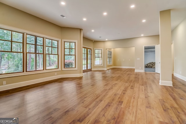 unfurnished living room with light hardwood / wood-style flooring