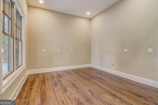 unfurnished room with light hardwood / wood-style floors