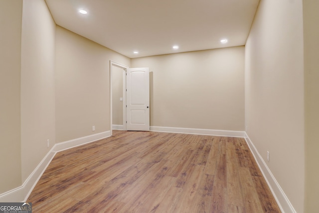 spare room with light hardwood / wood-style flooring