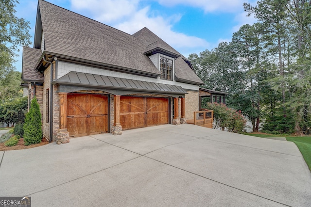 view of side of property with a garage