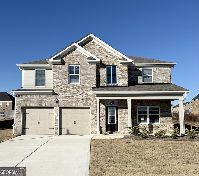 craftsman house with covered porch and a garage