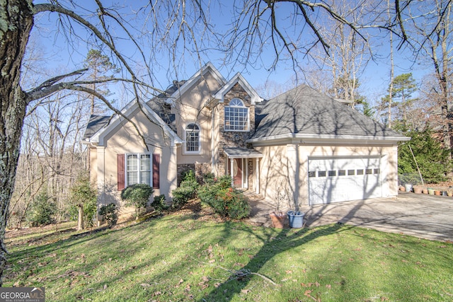 front of property featuring a front yard and a garage