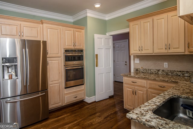 kitchen with light stone countertops, dark wood-type flooring, appliances with stainless steel finishes, tasteful backsplash, and crown molding