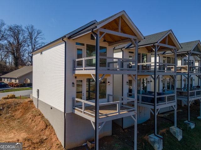 back of house with a balcony