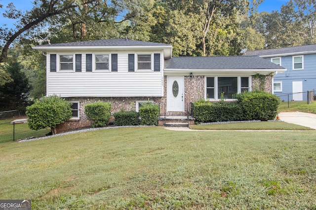 split level home with a front yard