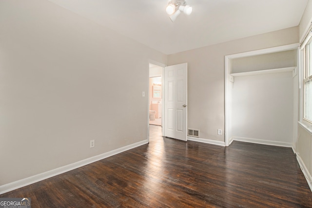 unfurnished bedroom featuring a closet and wood-type flooring