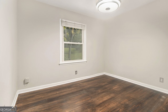 spare room with hardwood / wood-style flooring