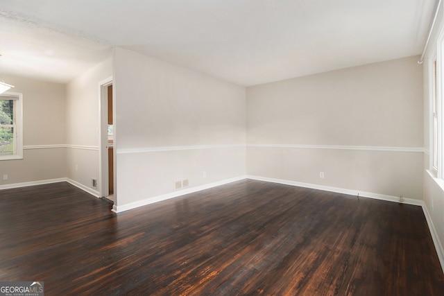 empty room featuring hardwood / wood-style flooring