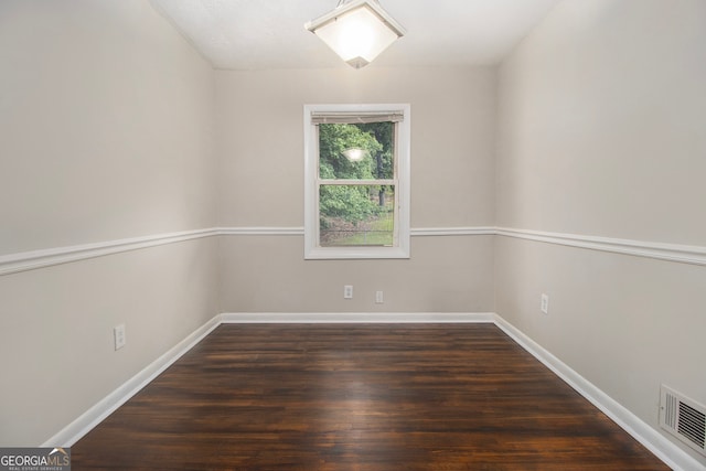 empty room with wood-type flooring