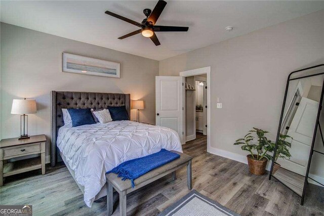 bedroom featuring light hardwood / wood-style flooring and ceiling fan